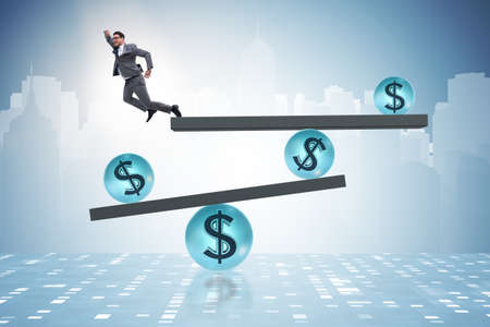 Businessman balancing in financial dollar conceptの写真素材