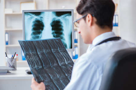 Doctor radiologist looking at x-ray images