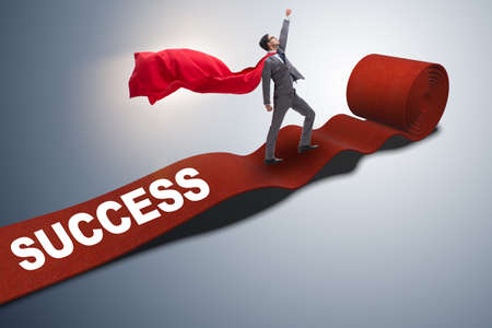 Superhero on the red carpet in success conceptの写真素材