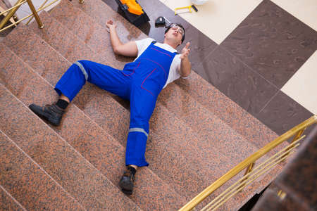 Dead contractor worker felling off the stairsの写真素材