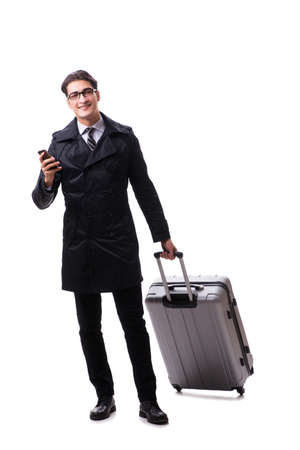 Young businessman with suitcase ready for business trip on white backgroundの写真素材