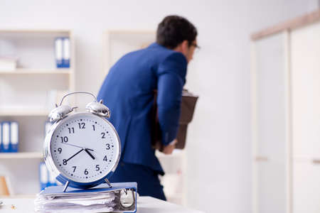 Businessman in rush trying to meet deadlineの写真素材