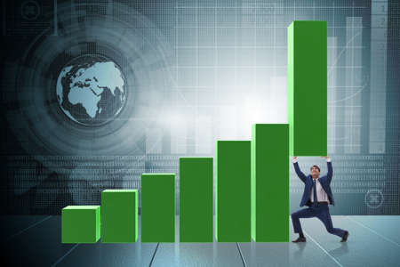 Businessman supporting growtn in economy on chart graphの写真素材