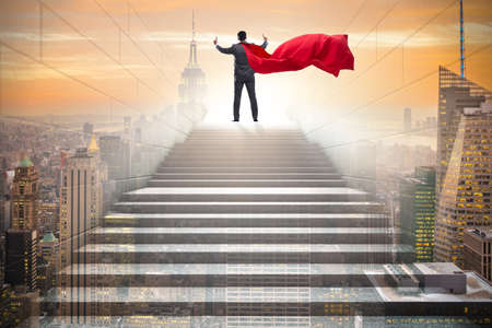 Businessman superhero successful in career ladder conceptの写真素材