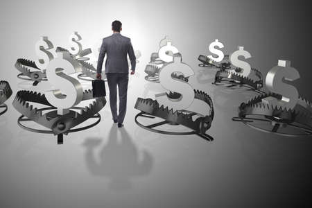 Businessman being trapped by dollarの写真素材