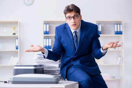 Businessman making copies in copying machine