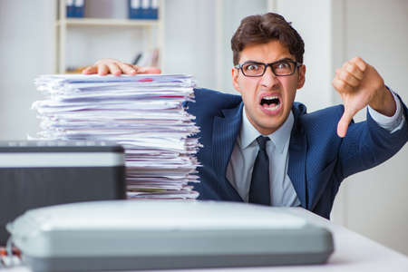 Businessman making copies in copying machineの写真素材