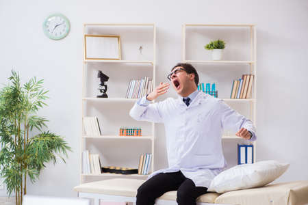 Doctor relaxing after complex surgery in hospitalの写真素材