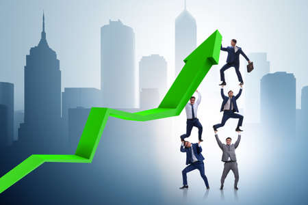 Businessman supporting growtn in economy on chart graphの写真素材