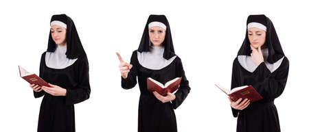 Young nun with bible isolated on whiteの写真素材
