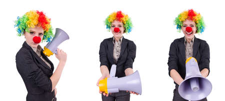 Businesswoman clown with loudspeaker isolated on whiteの写真素材