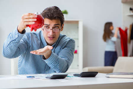 Young couple looking at family finance papers
