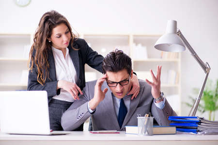 Unhappy boss having a chat with his secretaryの写真素材