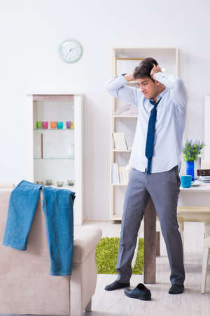 Businessman late for office due to oversleeping after overnightの写真素材