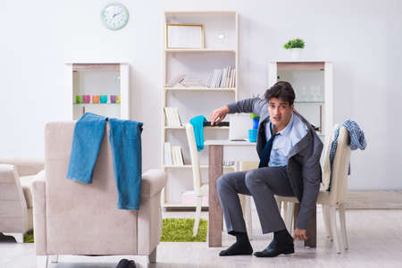 Businessman late for office due to oversleeping after overnightの写真素材