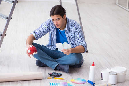 Young man overspending his budget in refurbishment projectの写真素材