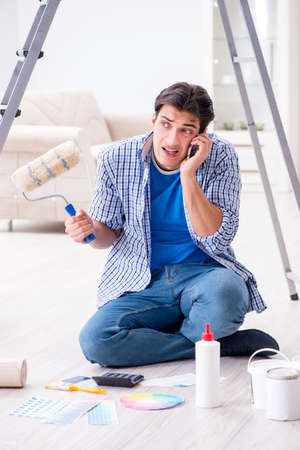 Young man overspending his budget in refurbishment projectの写真素材