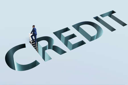 Businessman falling into trap of borrowing debt and creditの写真素材