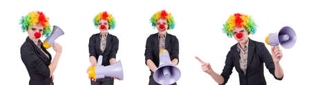 Businesswoman clown with loudspeaker isolated on whiteの写真素材
