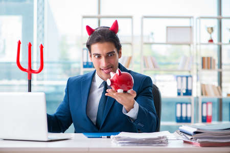 Devil angry businessman in the officeの写真素材