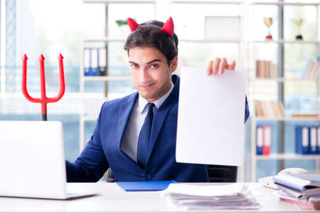 Devil angry businessman in the officeの写真素材