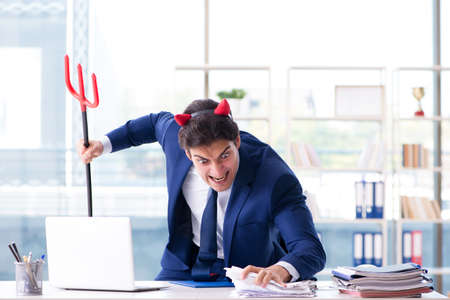 Devil angry businessman in the officeの写真素材