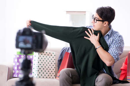 Male fashion blogger recording video for vlog