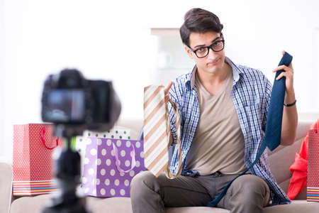 Male fashion blogger recording video for vlogの写真素材