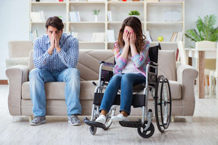 Desperate disabled person on wheelchairの写真素材