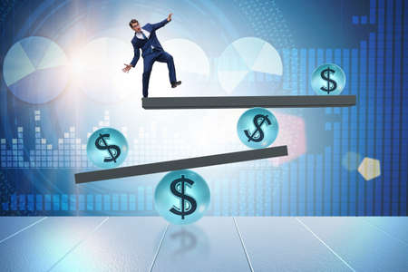 Businessman balancing in financial dollar conceptの写真素材