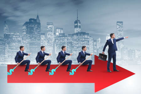 Team of businessmen in teamwork concept with boatの写真素材