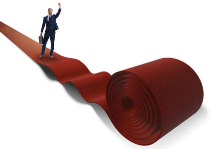 Businessman on red carpet isolated white backgroundの写真素材