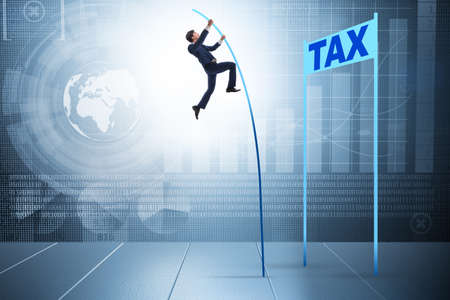Businessman jumping over tax in tax evasion avoidance conceptの写真素材