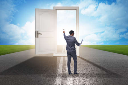 Businessman in front of door in business opportunities conceptの写真素材