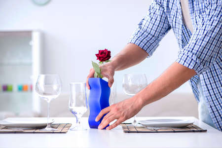 Man alone preparing for romantic date with his sweetheartの写真素材