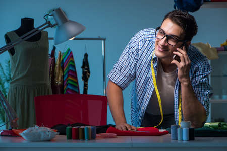 Male tailor working in sewer shop