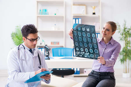 Doctor examining x-ray images of patient