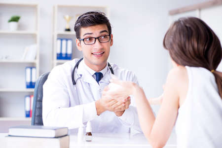 Woman with pet rabbit visiting vet doctorの写真素材
