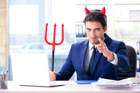 Devil angry businessman in the officeの写真素材