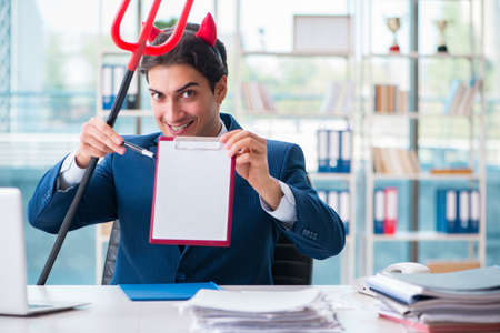 Devil angry businessman in the officeの写真素材