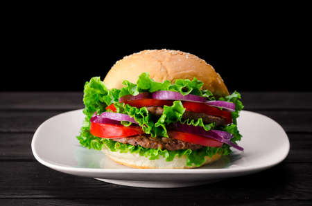 Burger served in bun in nutrition fast food conceptの写真素材