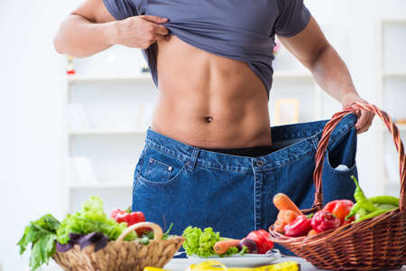 Young man in healthy eating and dieting concept