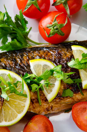 Fried fish served on the plateの写真素材