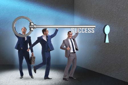 Businessmen in business success concept with keyの写真素材