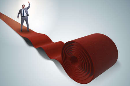 Businessman on the red carpet in success concept