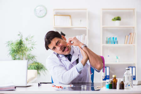 Doctor drug addict in the hospitalの写真素材