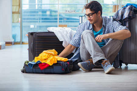 Young man preparing for vacation travelの写真素材