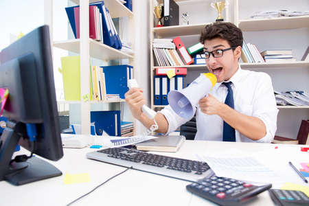 Busy frustrated businessman angry in the officeの写真素材
