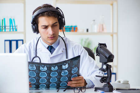 Male doctor listening to patient during telemedicine session