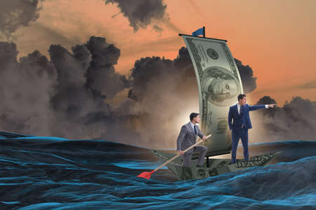 Business partnership with businessmen sailing on dollar boatの写真素材